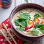 Thai Mahi Mahi Curry in red bowl with chopsticks