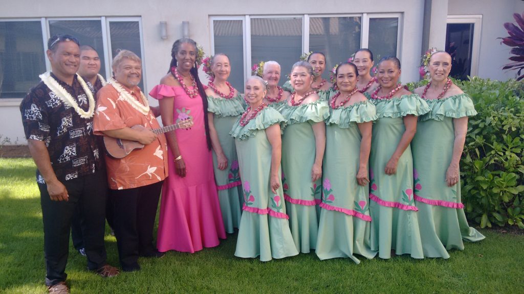 Halau Ka Ua Tuahine group wearing green and pink dresses