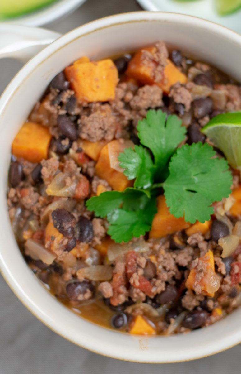 Black Bean Sweet Potato Chili in white bowl overhead close up