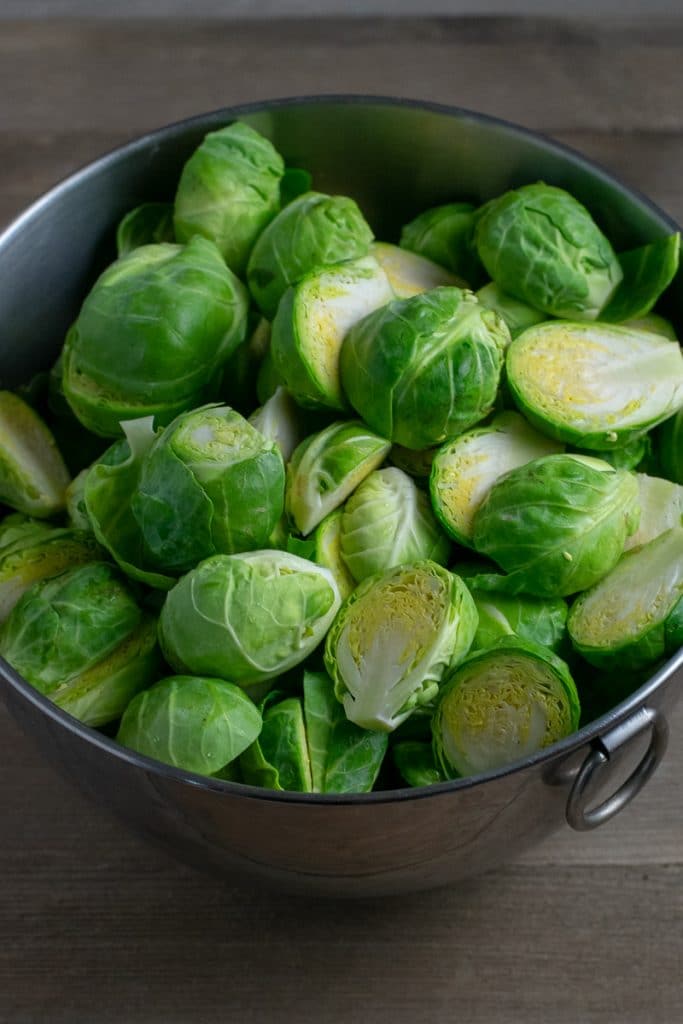 Fresh Brussels sprouts in metal bowl