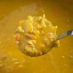 Close-up of finished butternut squash soup in ladle