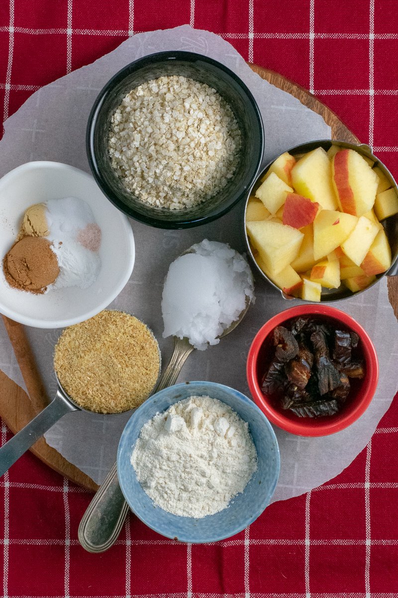 Ingredients for apple apricot muffins on wooden board