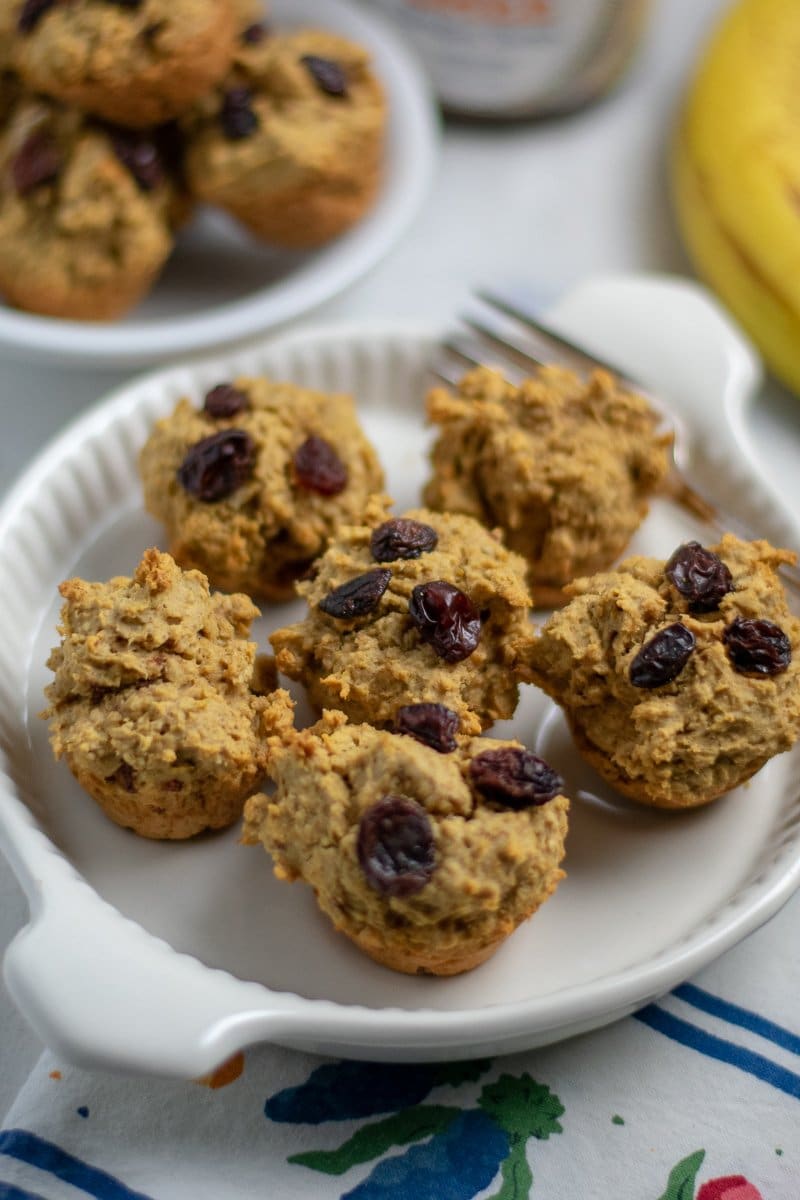 Apple apricot muffins on white rimmed plate