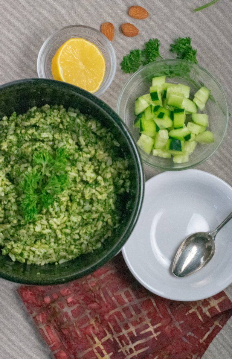 Nut Pesto Green Rice in large bowl with toppings in small bowls