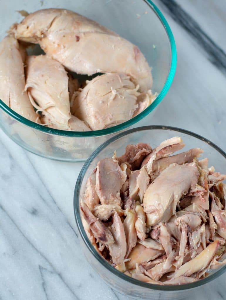 White and dark chicken in glass containers