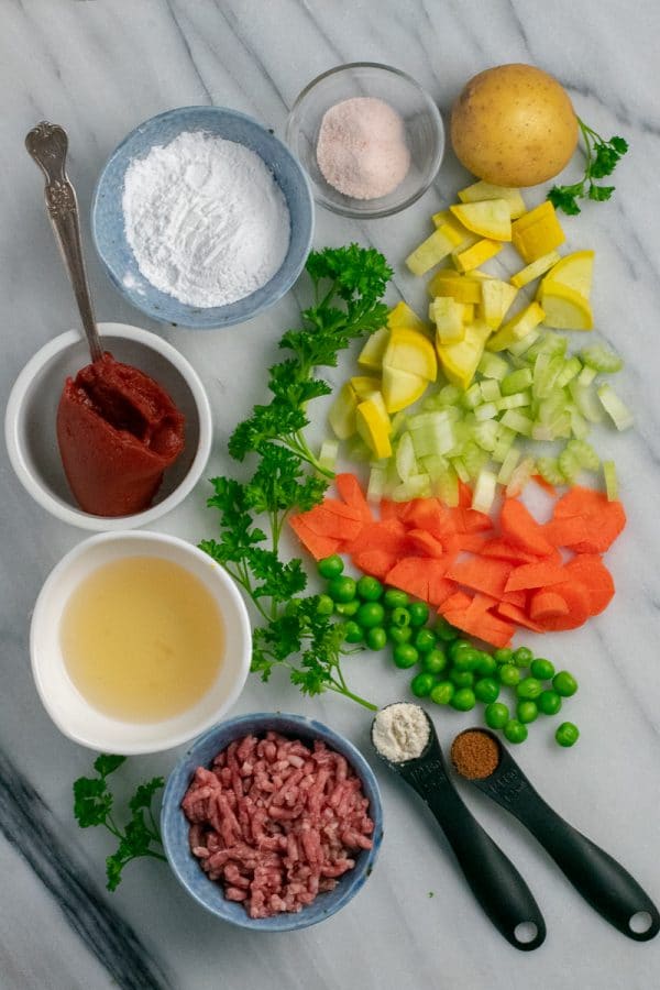 Beef Shepherd's Pie Ingredients on white marble slab