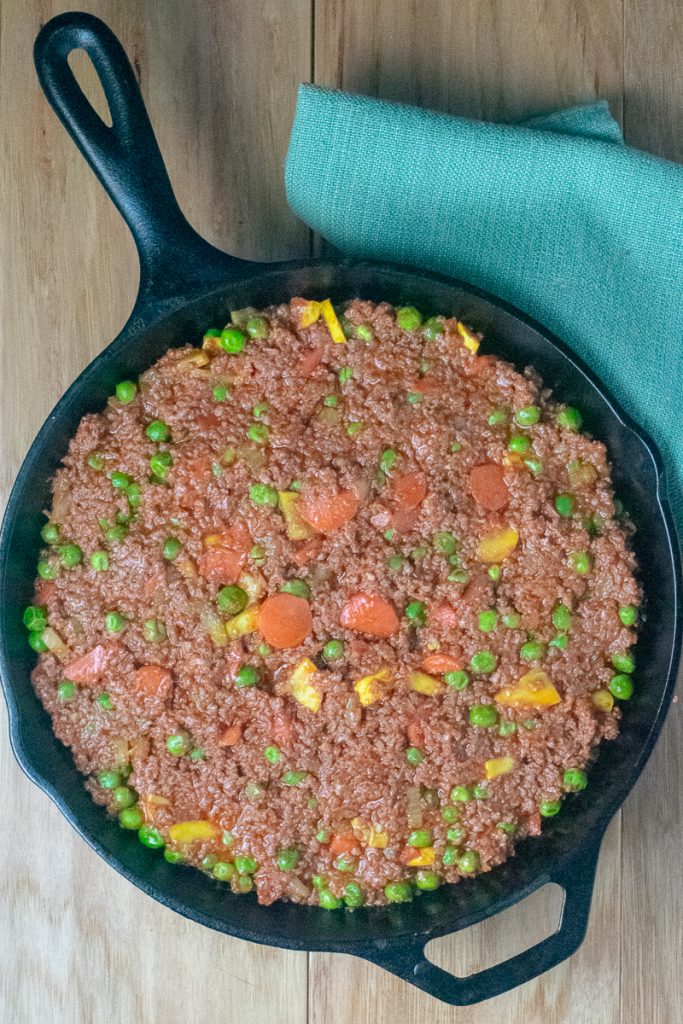 Beef Shepherd's Pie with filling cooked in cast iron pan