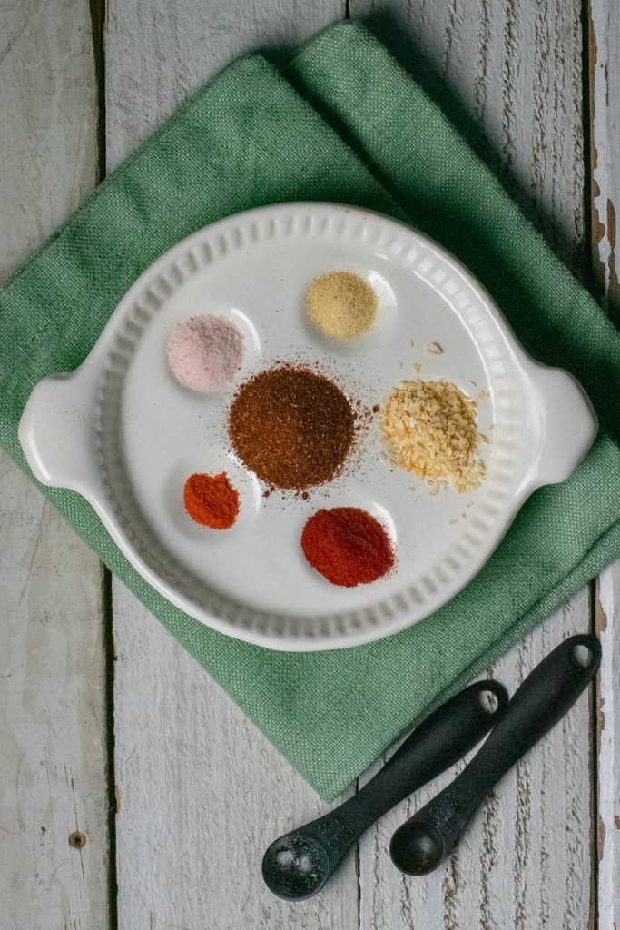 Taco seasoning gluten free on white plate and green napkin