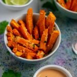 roasted sweet potato fries in small bowl with mayo and limes sq