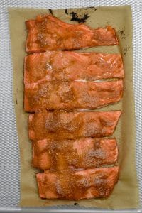 Steelhead fillets spread with miso marinade on baking pan