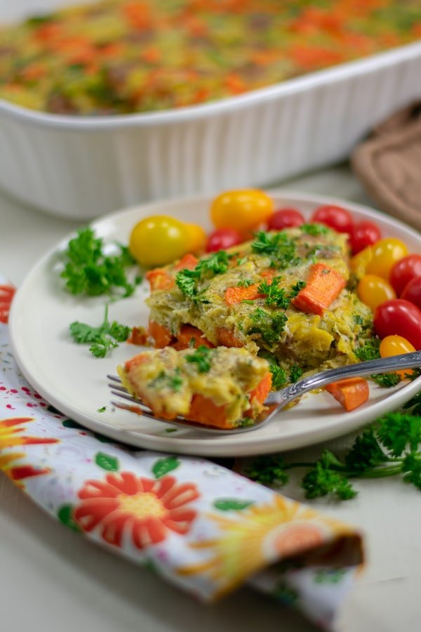 sweet potato sausage broccoli breakfast bake on white plate side view