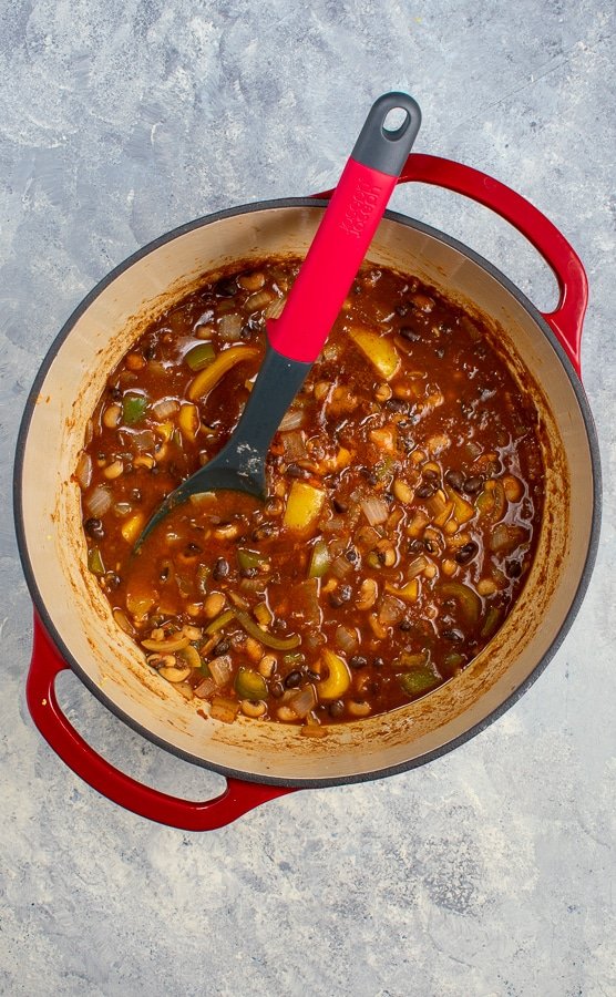 two bean chili 2 ways in cast iron Dutch oven with spoon