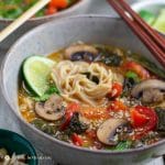 Thai red curry ramen in bowl with chopsticks
