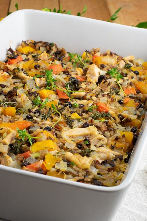 butternut squash chicken rice bake in white ceramic casserole side view