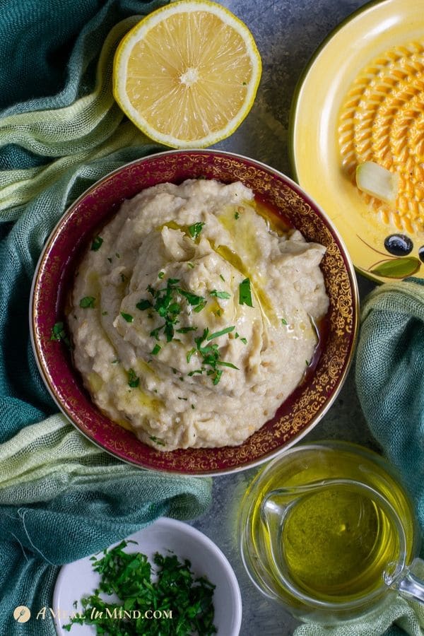 savory baba ghanoush dip in red-rimmed bowl