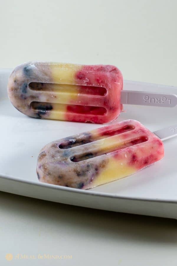 easy coconut yogurt fruit popsicles on white tray