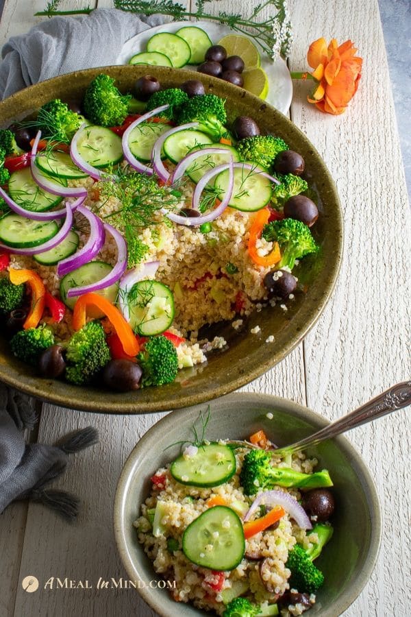 mediterranean quinoa salad with vegetables side view in two bowls