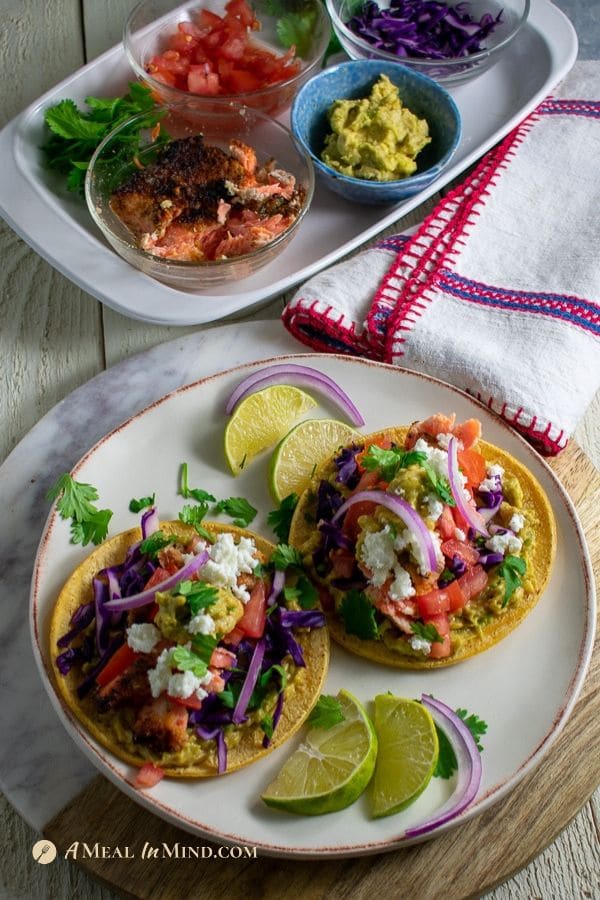 beautiful almond-crusted steelhead tacos with toppings