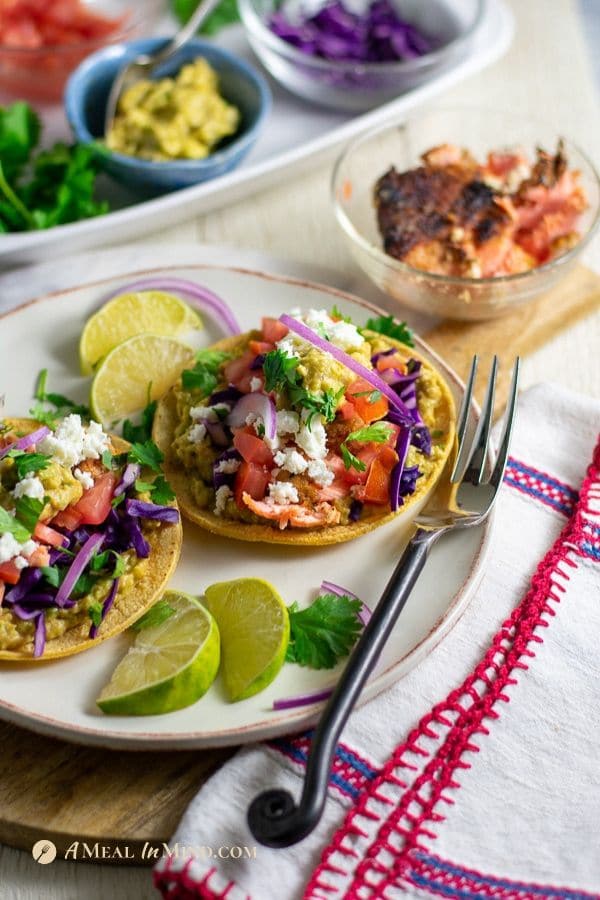 easy almond-crusted steelhead or salmon tacos on white plate