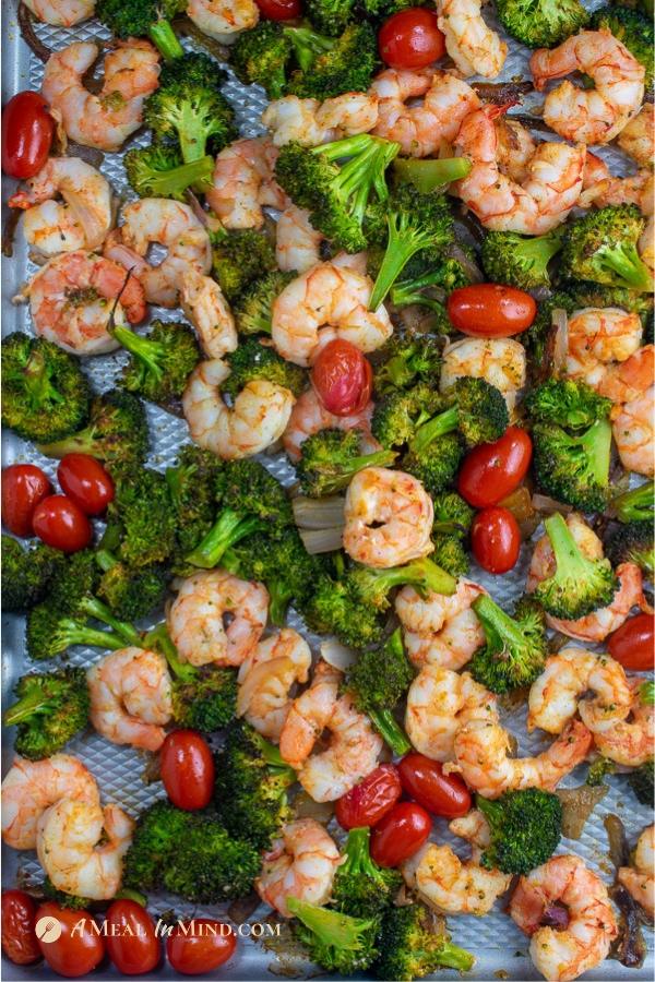 savory shrimp with broccoli and tomatoes overhead view