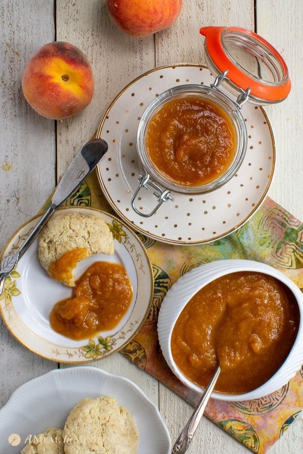 easy peach butter 3 ingredient on white plates with biscuit