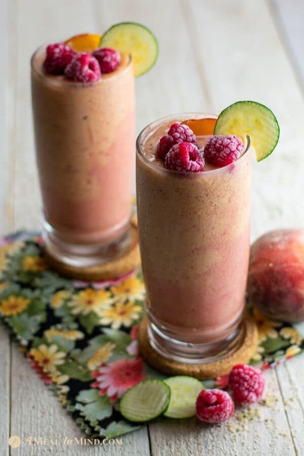 delicious Peach raspberry surprise smoothies in tall glasses from side view