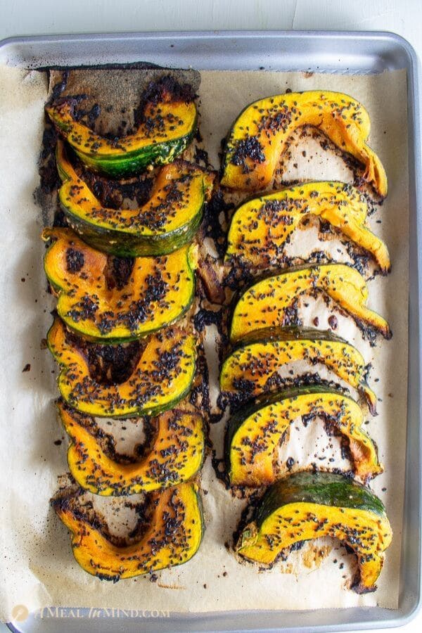 delicious roasted kabocha with black sesame on baking tray