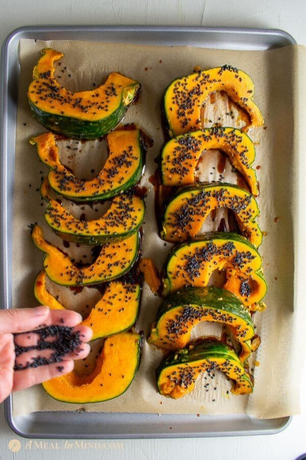 roasted kabocha with black sesame to be cooked on baking tray