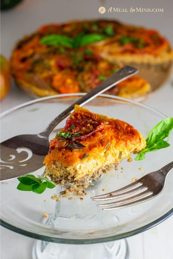 slice of savory roasted heirloom tomato tart with chickpea-walnut filling