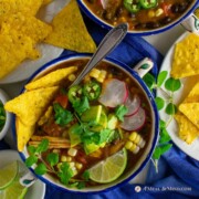 savory roasted hatch green chile tortilla soup in patterned bowls