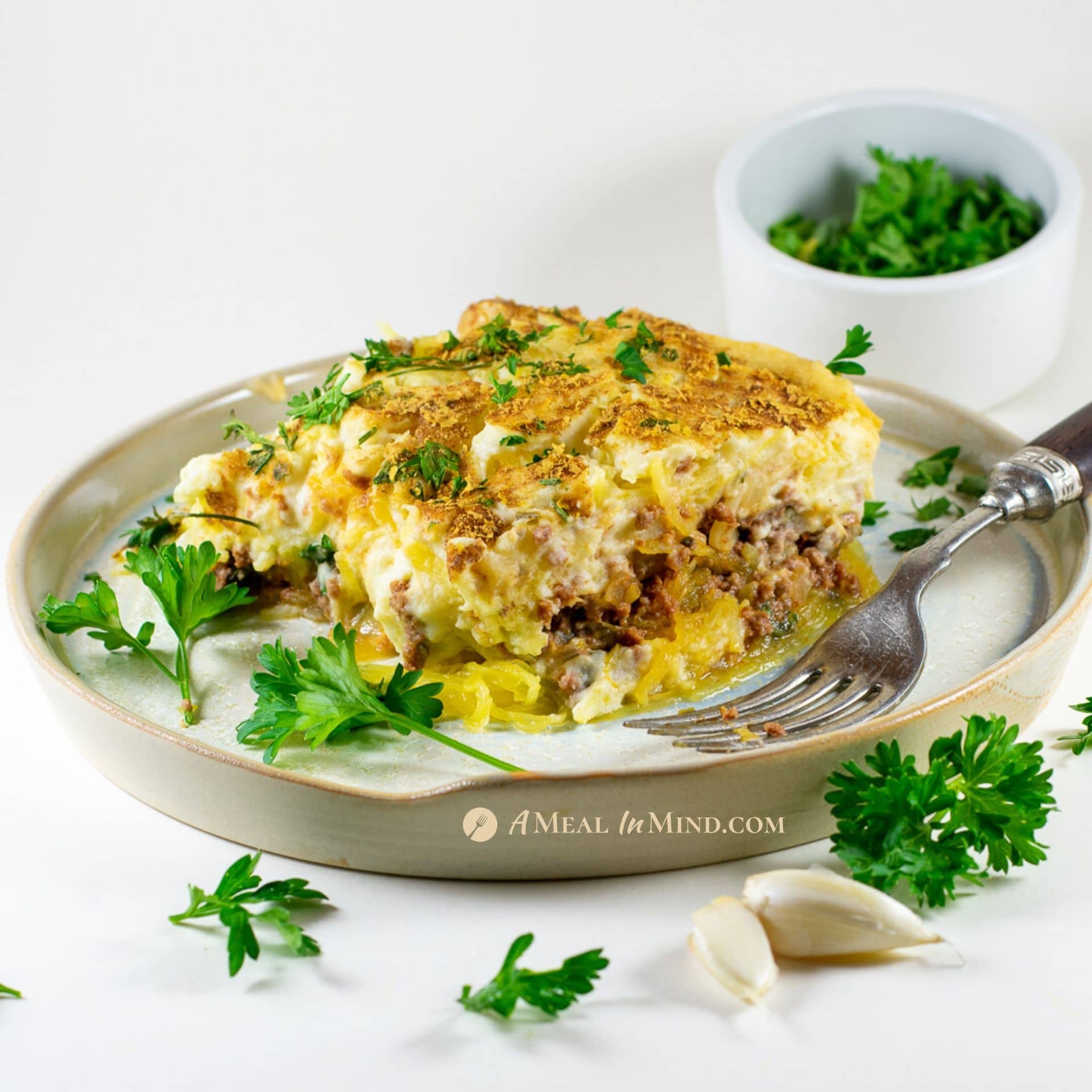 savory gluten-free spaghetti squash Greek pastitsio on white plate