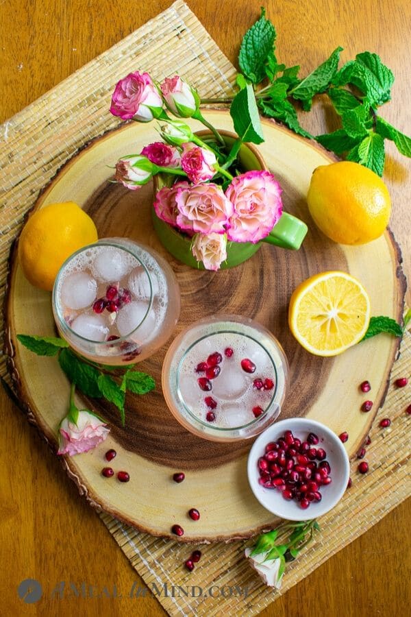 refreshing sparkling meyer lemon mocktail overhead view on wood tray