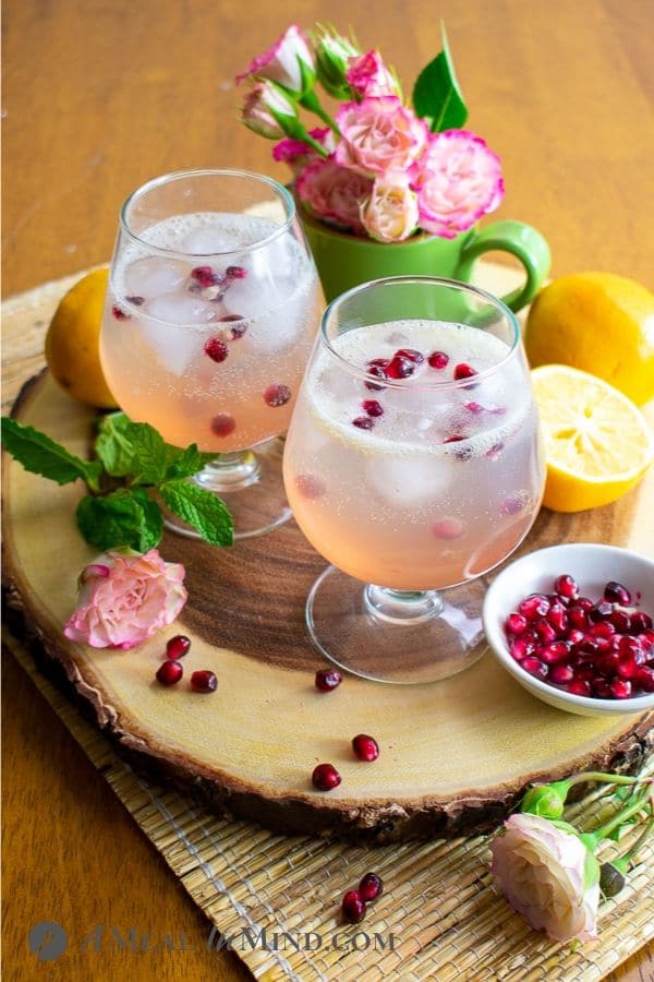 refreshing sparkling meyer lemon mocktail side view on wood tray