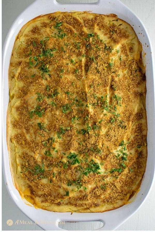 baked gluten-free spaghetti squash Greek pastitsio on white baking dish