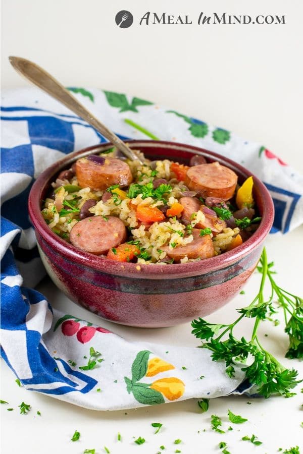 dirty rice vegetable sausage bake side view in red bowl