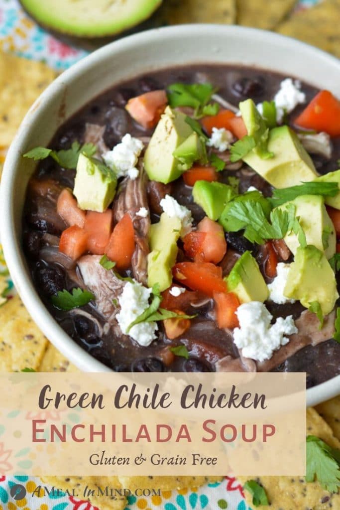 Green chile chicken enchilada soup in white bowl pinterest image