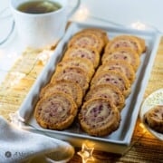 cranberry almond flour pinwheel cookies on white plate