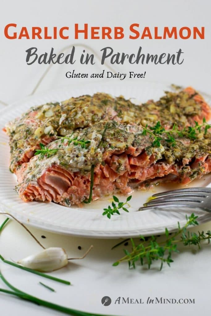 Garlic Herb Salmon Baked in Parchment side view on white plate