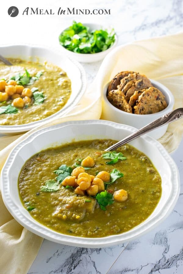 cauliflower wild rice curry soup in white bowls