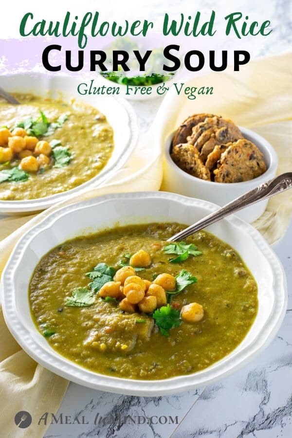 Cauliflower Wild Rice Curry Soup in white bowls side view