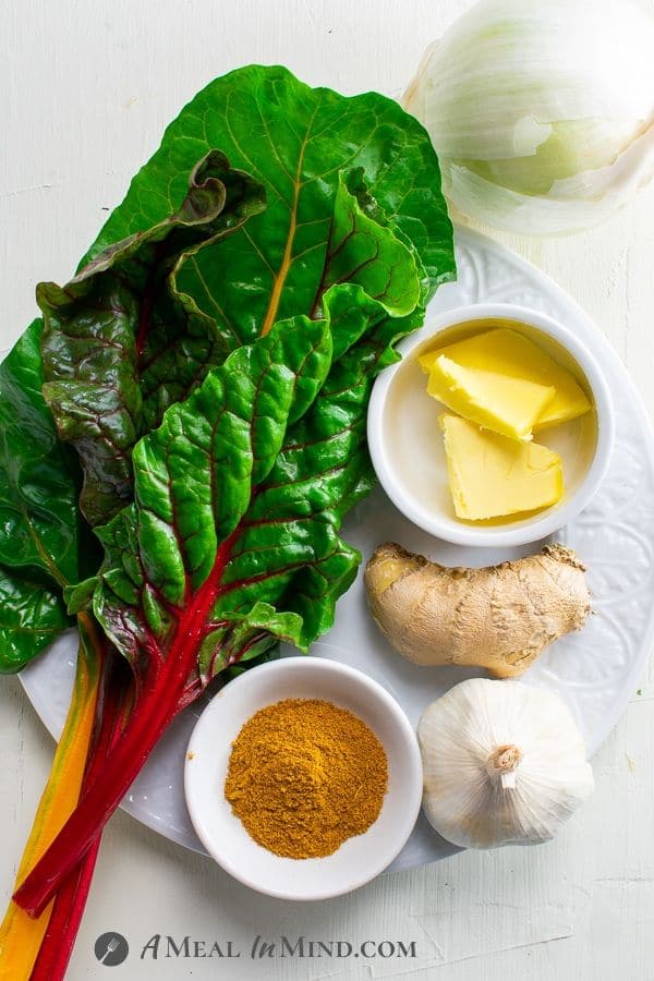 Instant Pot Swiss Chard Saag ingredients on white plate