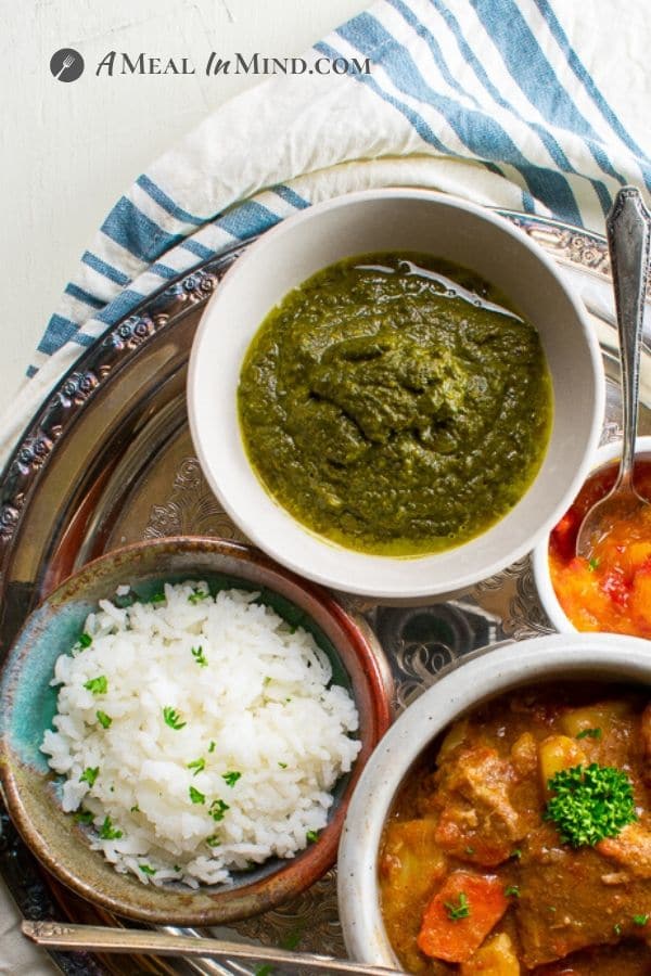 Instant Pot Swiss Chard Saag with rice and lamb korma in bowls