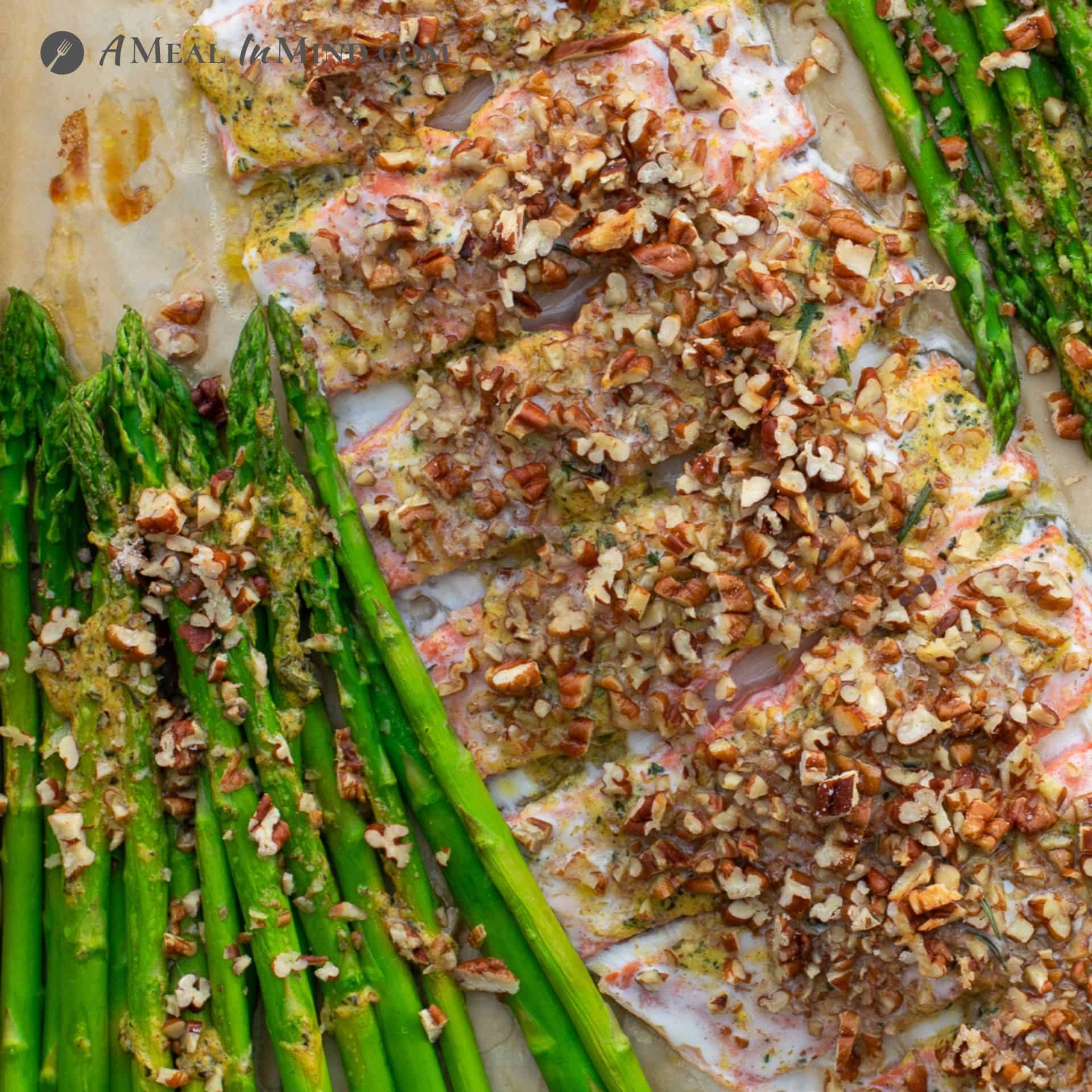 Pecan Mustard Salmon with Asparagus close-up on baking sheet