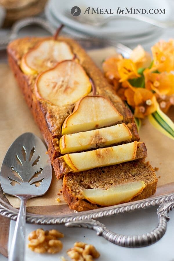 Walnut-Ginger Pear Bread sliced and ready to serve on tray