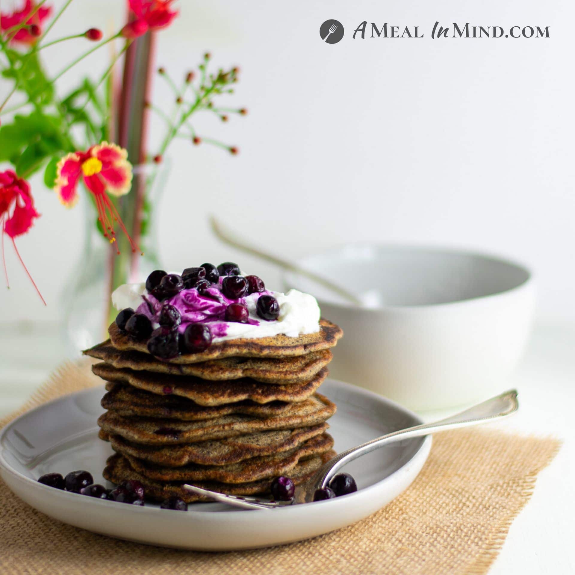 Buckwheat-Currant Pancakes Gluten Free stack on white plate