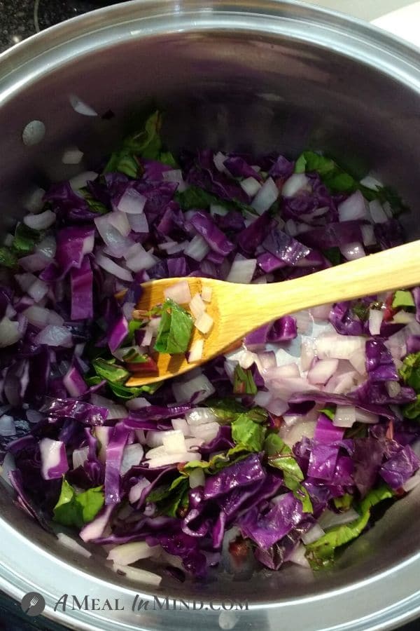 Beet-Cabbage Borscht showing cabbage cooking in soup pot