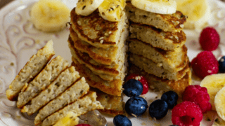 Oat-Hemp Protein Pancakes with fruit stacked on white plate