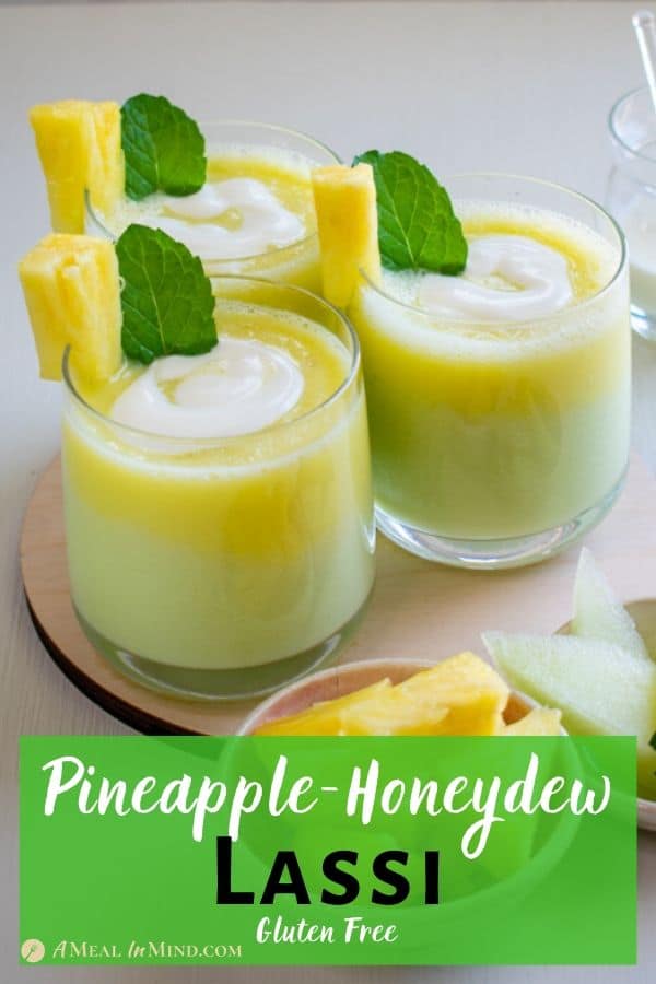 Layered Pineapple-Honeydew Lassi in three glasses with pineapple and mint