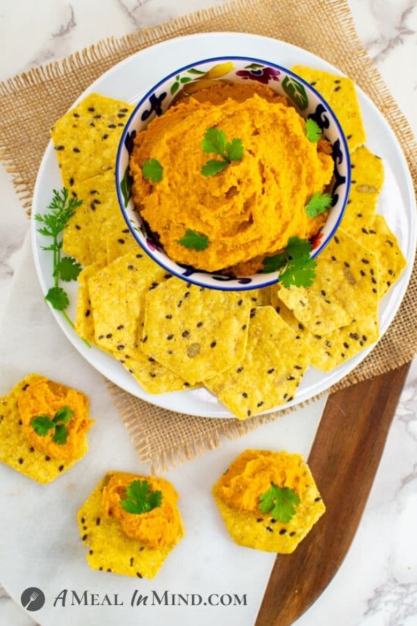 Moroccan Roasted-Carrot Hummus with chips overhead view