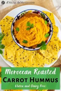 Moroccan Roasted-Carrot Hummus in patterned bowl overhead view pinterest image